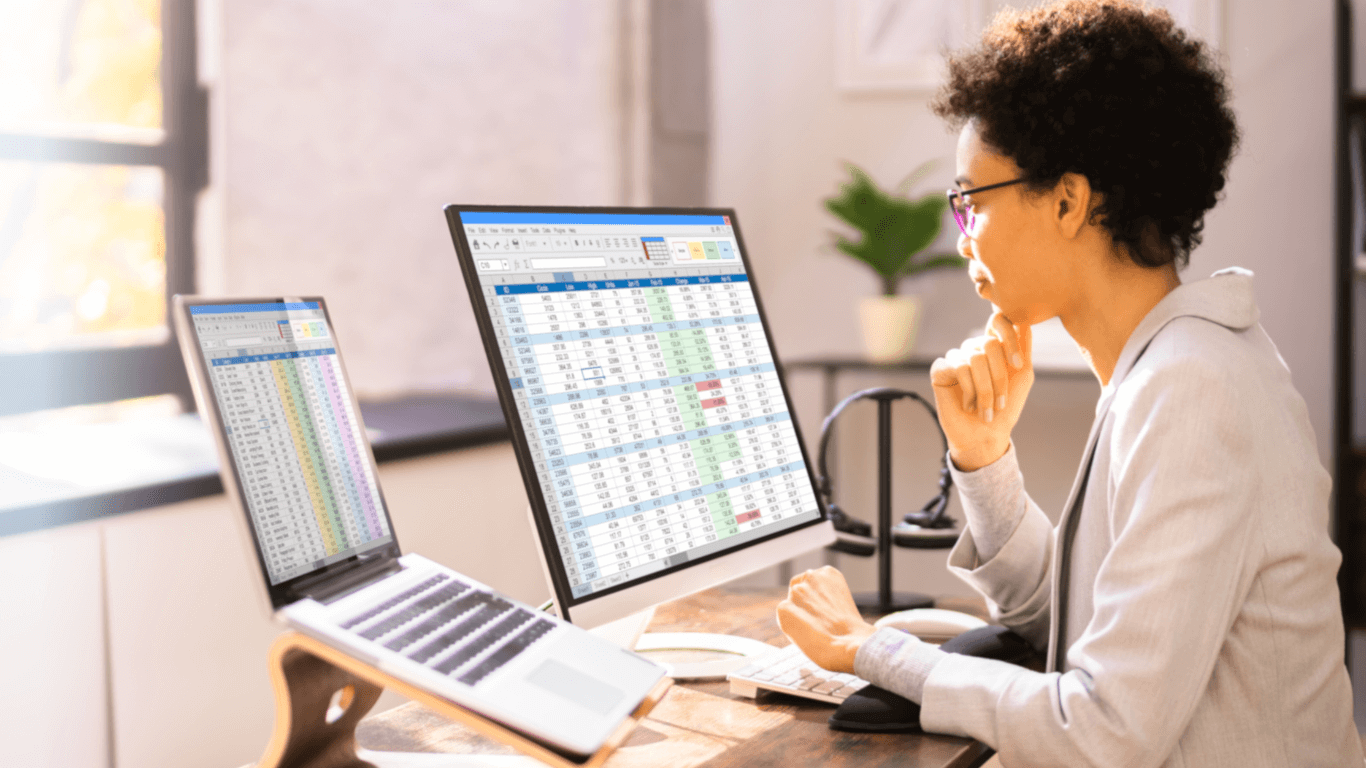 Woman looking at billing codes on computer